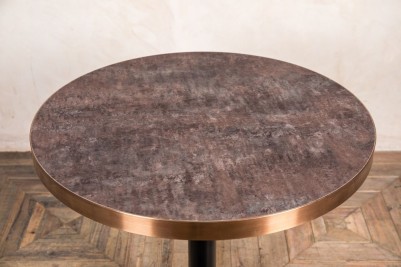 aged brass edged dining table circular